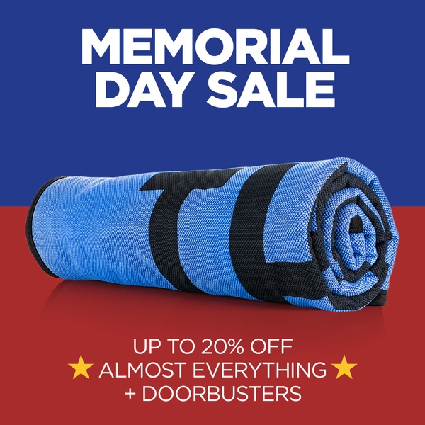A high-contrast, text-heavy 1:1 ad creative promoting a 20% off site-wide Memorial Day sale featuring a rolled microfiber towel as the visual anchor.